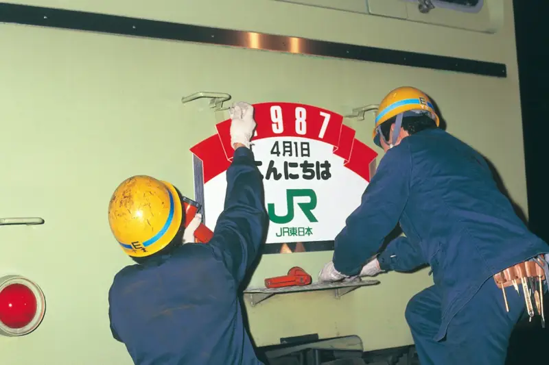 Workers applying the JR branding. Image courtesy of NDC